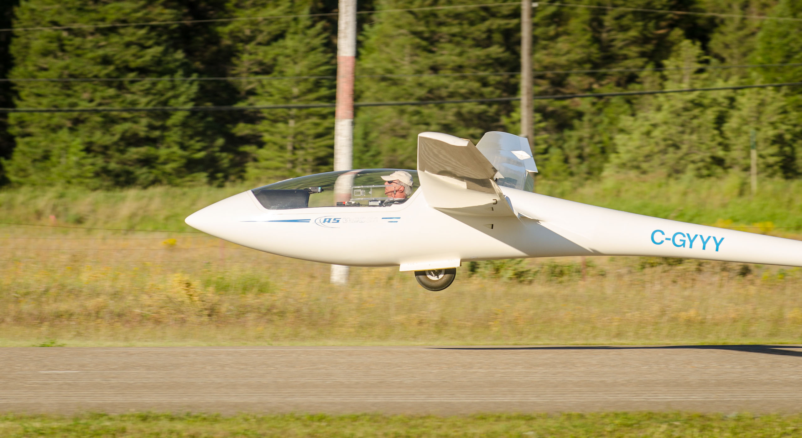 Glider on a low pass above the airfield